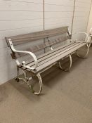 19th century Victorian garden bench with cast iron scrolled sides and new wooden slats to seat and