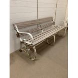 19th century Victorian garden bench with cast iron scrolled sides and new wooden slats to seat and