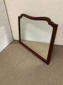 A wall hanging mirror