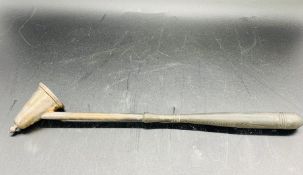 A White metal candle snuffer