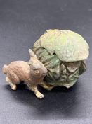 A Cold painted inkwell in the form of a rabbit and a cabbage.