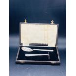 A Roberts and Dore Christening set in silver, boxed.