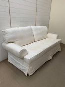 Three seater sofa with white loose covers by Multiyork (H95cm W190cm D94cm)