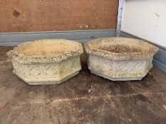 A pair of octagonal Gothic style concrete planters