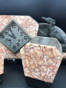 An Art Deco Marble Mantle Clock with garniture and figure of a dog.