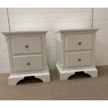 A pair of white bedside tables with silver contemporary handles (H60cm W47cm D39cm)