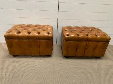 Pair of button back leather footstools on bun feet (H38cm W62cm D40cm)