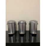 Three stainless steel bins