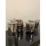 Selection of white metal ice buckets, hammered wine buckets and lidded pot with bird handles