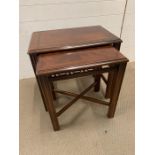 Nest of mahogany tables with pierced backs