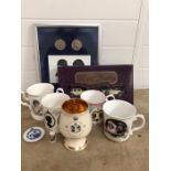 A selection of Royal collectable items to include cups, cars and a print