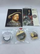 A selection of collectable coins including two £5 coin packs Henry VIII and The Restoration of the