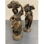 A pair of decorative figures