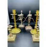 A selection of three pairs of candlesticks, brass and silver plated.