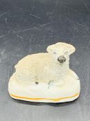 A Staffordshire figure of a lamb