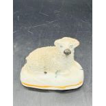 A Staffordshire figure of a lamb