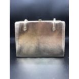 A gold ladies clutch bag