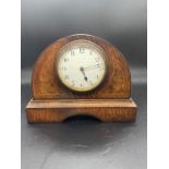 A French walnut inlaid mantel clock