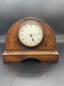 A French walnut inlaid mantel clock