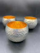 Three metal hammered candle holders (8cm x 10xm)