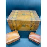 An inlaid work box and two leather jewellery boxes.
