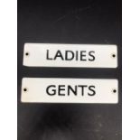 Two small metal signs "Ladies" & "Mens"