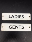 Two small metal signs "Ladies" & "Mens"