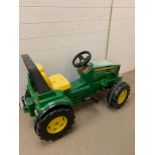 A children's John Deer tractor (missing the front loader)