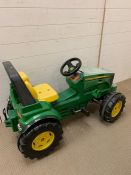 A children's John Deer tractor (missing the front loader)