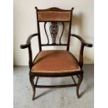 A mahogany open armchair with pink upholstered seat and back