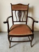 A mahogany open armchair with pink upholstered seat and back