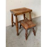 Two oak stools of different sizes