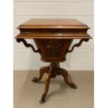 A Victorian walnut work table, hinged bur walnut top revealing fitted interior (H75cm W49cm D40cm)