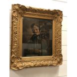 An Oil on Board of a Lady knitting in a gilt frame