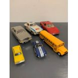 A selection of six Diecast vehicle of various makers, ERTL, Kinsmart and Burago