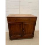 A Chest of drawers opening to a washstand (H90cm W93cm D56cm)