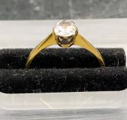 A Diamond Solitaire ring on an 18 ct yellow gold and platinum setting