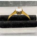 A Diamond Solitaire ring on an 18 ct yellow gold and platinum setting