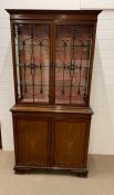 A mahogany inlaid library bookcase on bracket feet (H211cm W107cm D44cm)