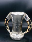 HORSE RACING INTEREST: A Hallmarked silver trophy with horn handles engraved The Racegoers Club