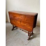 Victorian mahogany double drop Sutherland table on turned gateleg and twin pillar end supports