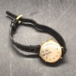 A 9 ct gold Ladies watch on a leather strap
