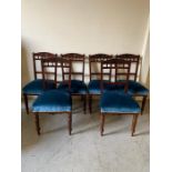 Six mahogany chairs with spindle backs and blue upholstered seats