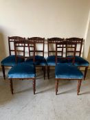 Six mahogany chairs with spindle backs and blue upholstered seats