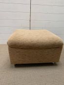 1960's upholstered foot stool on castors