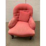 Pink upholstered bedroom chair with button and turn legs