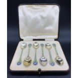 A Boxed set of six silver and enamel teaspoons, Birmingham hallmark 1935