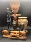 A selection of carved African ornaments, various themes