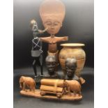 A selection of carved African ornaments, various themes