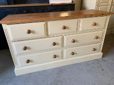 Pine and cream low chest of drawers, three short over four drawers